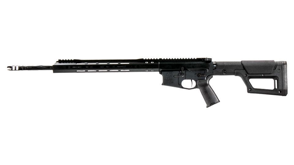 A black in color, fluted barrel AR with a white background.