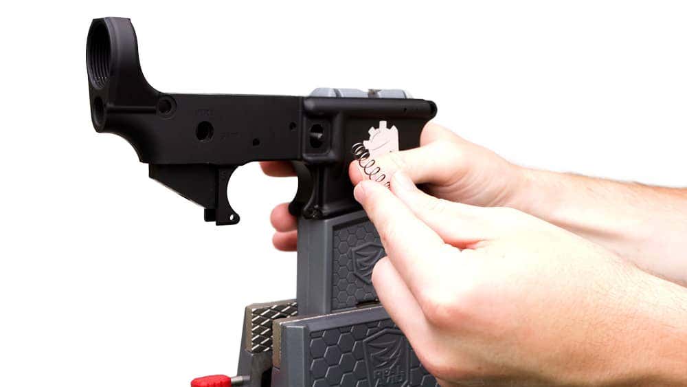 Installation of magazine spring
